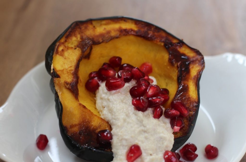 Cashew Cheese and Pomegranate Filled Acorn Squash
