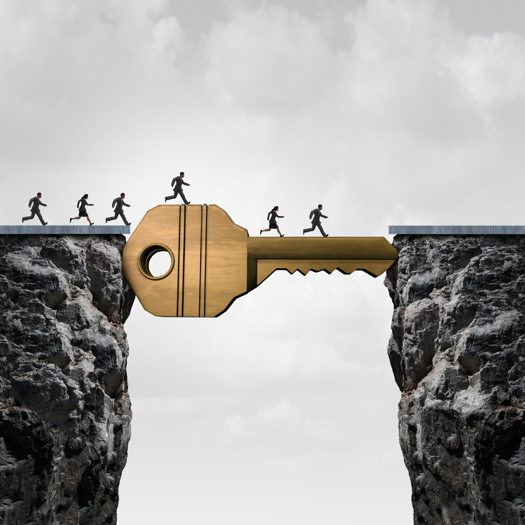 A line of people walk across a ravine using a bridge in the form of a key. The key to executing and maintaining a new habit
